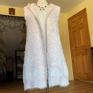 Women’s soft pink shag fur vest with hood.